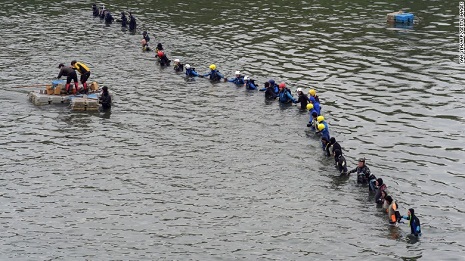 Rescuers search for 8 still missing from Taiwan plane that crashed in river